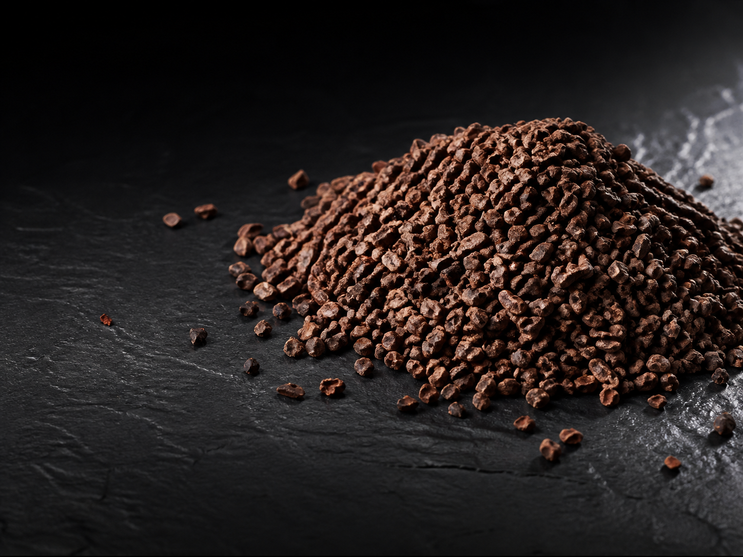 A detailed mound of roasted cacao nibs